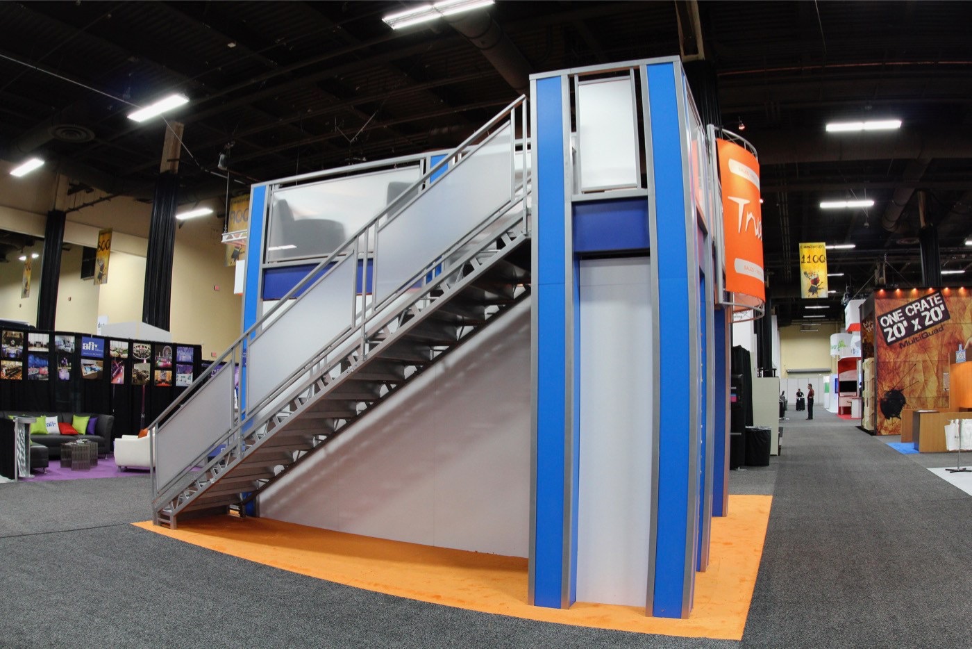 Open area below two story trade show exhibit stairs on rental exhibit