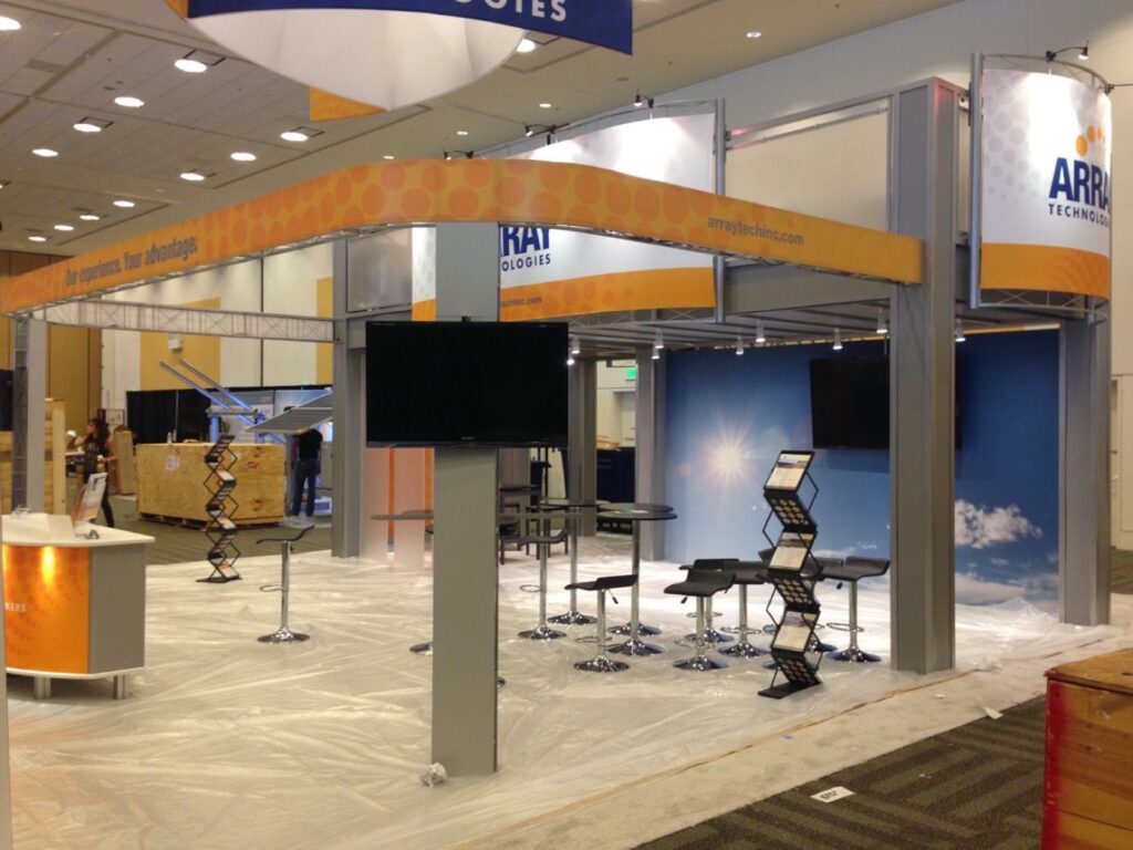 Front view of open floor plan double deck exhibit booth rental design