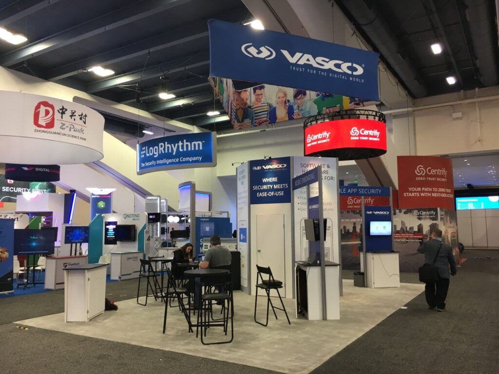 20 x 20 trade show exhibit rental design has a closet for storage monitors work stations and meeting areas